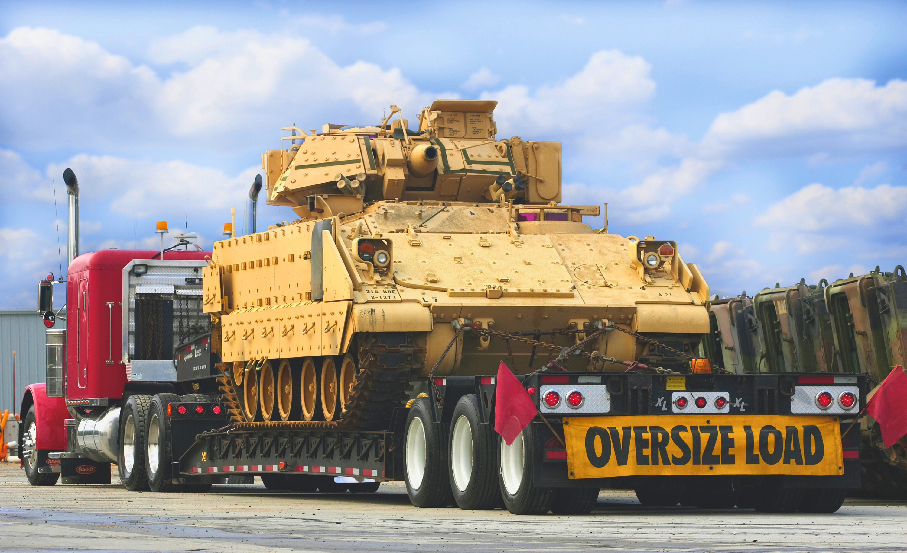 Landstar heavy-haul transportation example with an oversized tracked vehicle on a specialized trailer