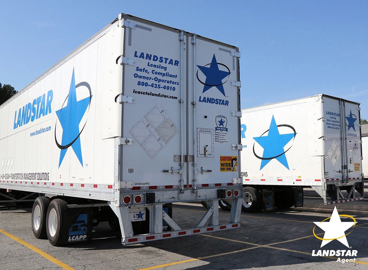 Landstar dry van trailers parked in a trailer yard